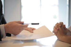 A person giving a contract to another